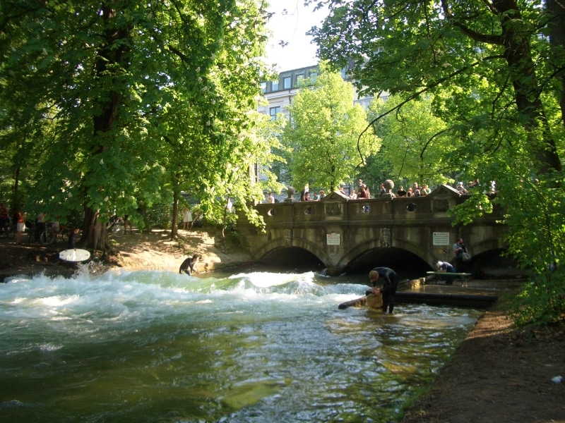 A surfer on the Eisbach wave, in Munich's English Garden